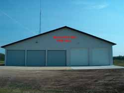 A fire department building with 5 garage doors