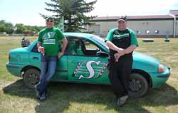 2 men with with a green car at Saskatchewan Day